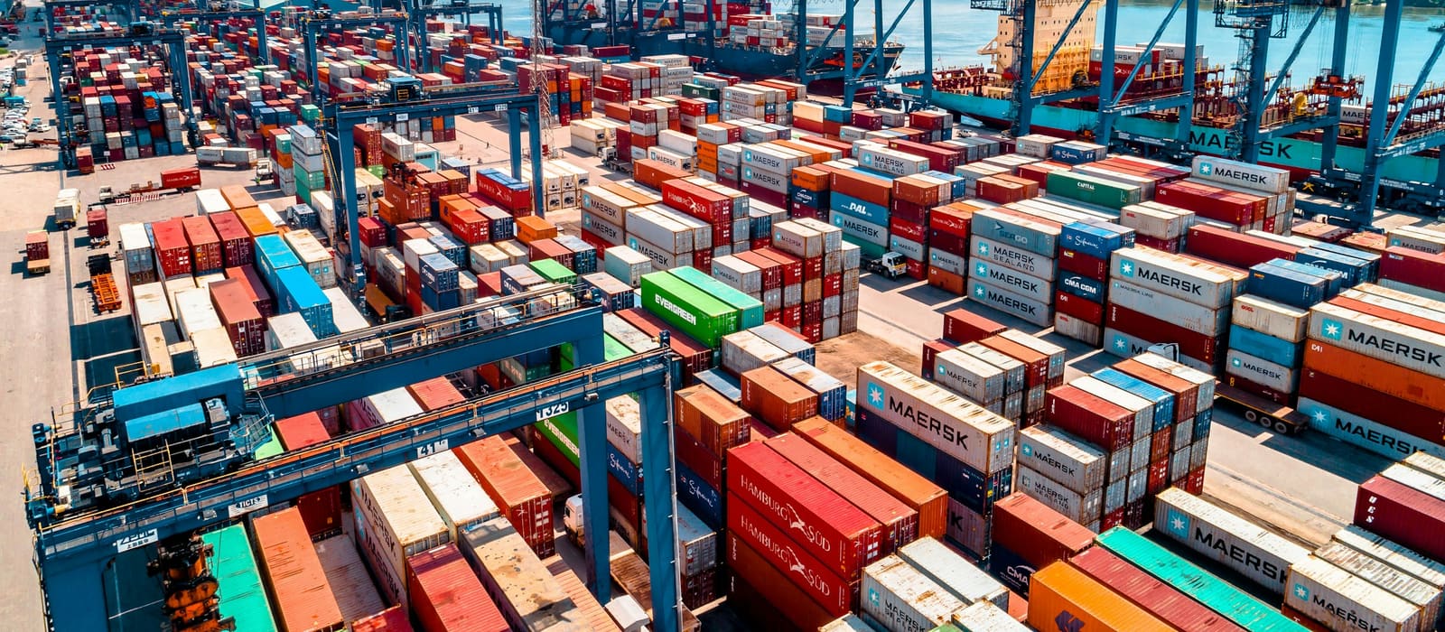 Containers stacked at a port terminal awaiting customs clearance